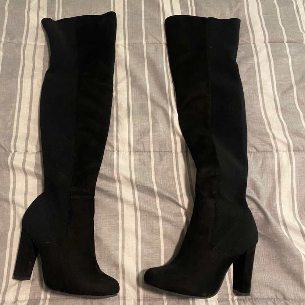 Thigh high heeled boots
